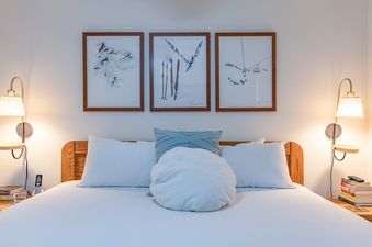 A close-up view of the cozy bed in the Gros Ventre A10 bedroom.