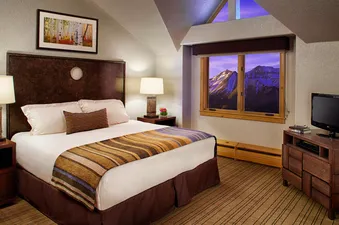Franz Klammer Lodge Three Bedroom Residence features a beautifully appointed bedroom.