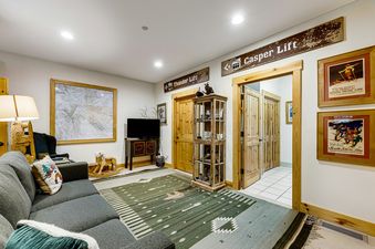 The inviting living room features rustic decor and comfortable seating at 3137 Arrowhead.