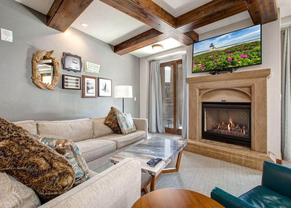 Cozy living room at Abode at First Dawn A with a fireplace and comfortable seating.