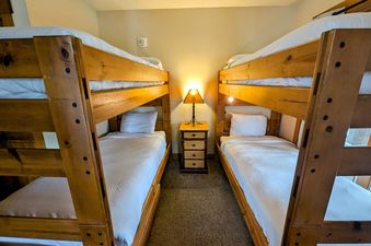 The bedroom at Springs 8819 features two sets of bunk beds.