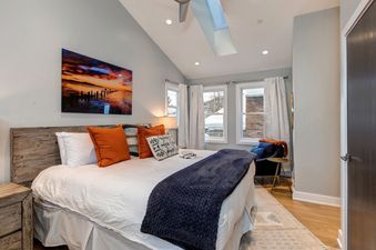 Cozy bedroom at Abode at Pick N Shovel with natural light.