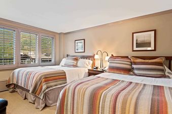 Two comfortable beds fill the Lodge Tower 478 2BR bedroom, inviting guests to relax and unwind.