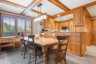 The Lodge Tower 599 2 Bedroom features a dining table with seating for six.