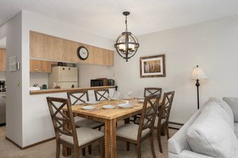 The dining area and kitchen of Meadow Ridge 31 are showcased.