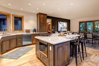 Spacious and modern kitchen with a large marble island at Sleeping Indian Jackson Hole.