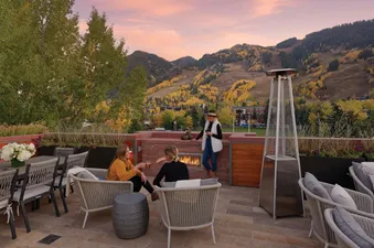 The Clubhouse is a modern property with a rooftop patio, a fireplace, and a view of the mountains.