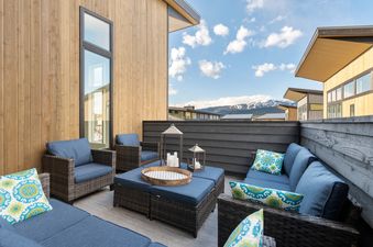 A private patio at Quarry B8 with outdoor seating and mountain views.
