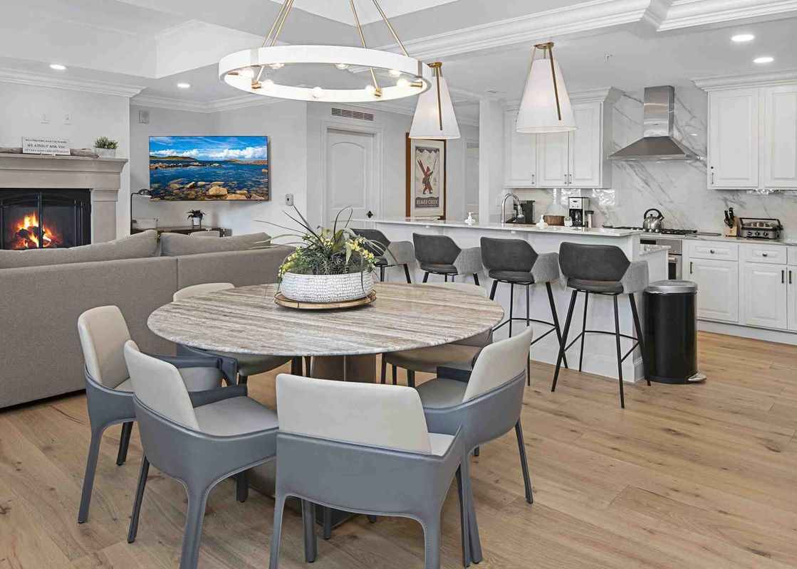 An inviting open-concept living space in Ritz Carlton Vail 314, featuring a comfortable living room, elegant dining area, and a stylish kitchen bar.