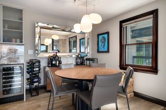 Torian Plum Plaza 803 dining table with wine fridge and storage.