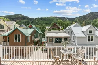 Living room with access to outdoor deck