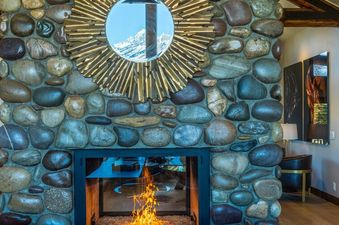 A close-up view of the natural stone fireplace at Abode at Sage Springs.