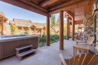 The exterior patio at Villas At Tristant 203 features a hot tub.