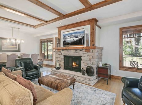 Living area with stone fireplace in Shooting Star 106.