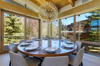 A beautifully staged dining room at Fairway Views Estate At Vail Golf Club.
