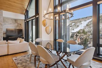 The Lion W605 dining area features modern design and beautiful mountain views.
