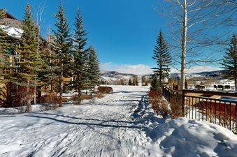 Enjoy snow-covered mountain views from the ski path at Top of the World at Bachelors Gulch.