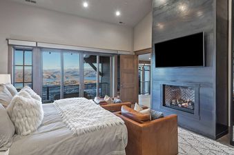 Dreamscape 365 bedroom with fireplace and view.