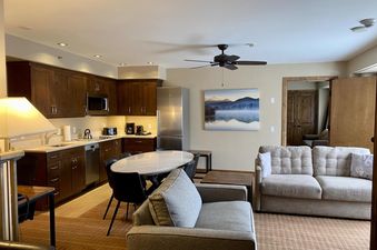 Living area and kitchen in Peaks Penthouse 643.
