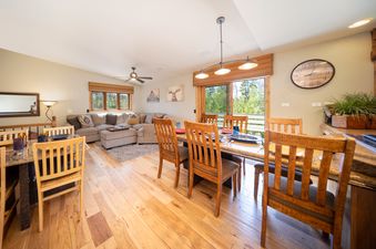 The living area and dining space of Jabberwocky Home are captured, showcasing the open-concept layout.
