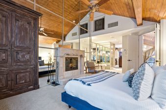 Primary Bedroom with fireplace - North