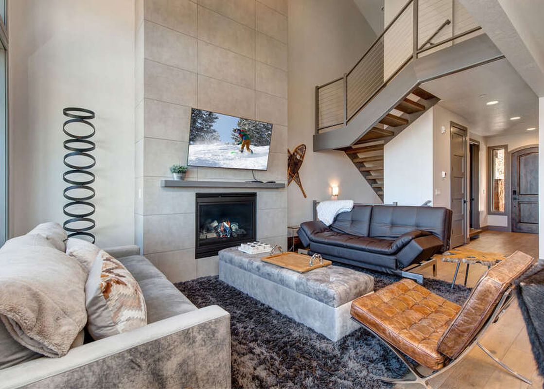 The Abode at Juniper Ridge living room offers a cozy space for relaxation.