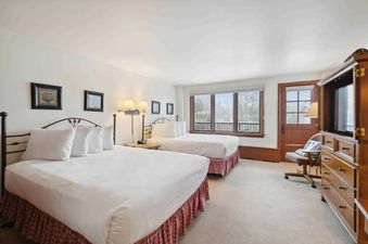 The Lodge Tower 294 features a cozy bedroom with two beds and a window with a view.