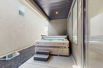 Private outdoor hot tub under a covered patio at Silver Creek Retreat.