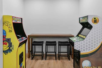 Retro arcade games and bar seating in SkyRidge 1152.