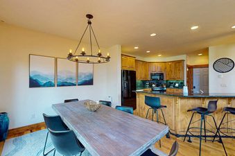 Dining table and kitchen at EagleRidge Townhomes 1510.