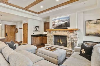 Living area in Shooting Star 304 featuring a fireplace and a large sectional sofa.