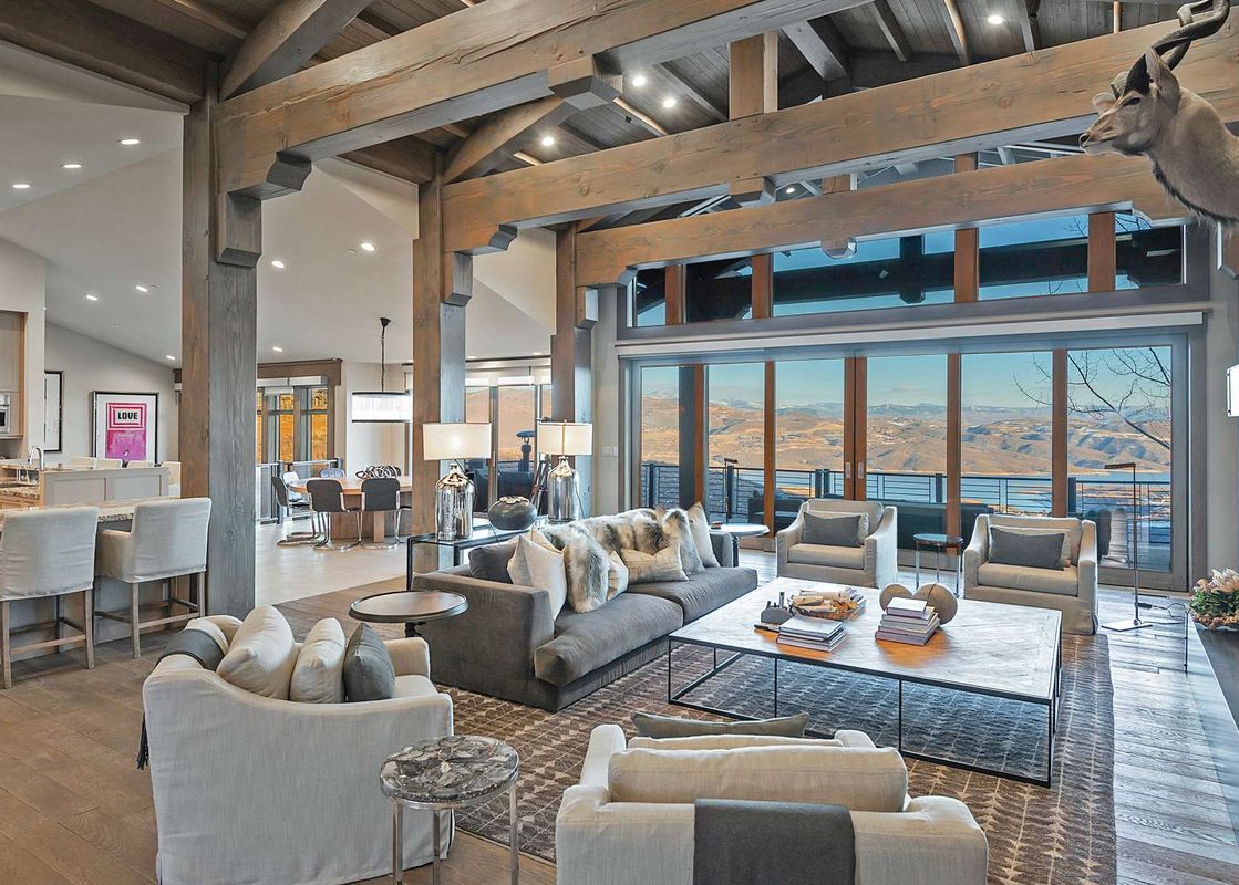 The Dreamscape 365 living room offers comfortable seating and stunning mountain views.
