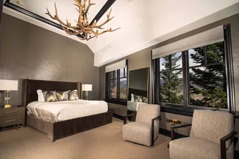 The beautifully decorated bedroom at Mountain Hideaway offers a luxurious retreat.