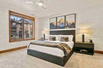 The bedroom in Shooting Star 304 features a comfortable king bed and stunning views.