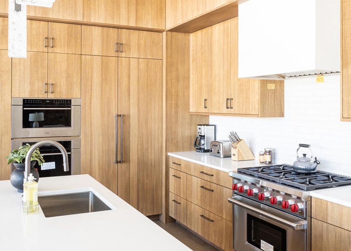 The kitchen at Moonlight Basin 8C Speedwell features stainless steel appliances, modern cabinetry, and a large island.