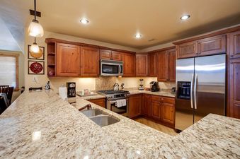 The kitchen in Bear Lodge BL6111 is complete with modern appliances and granite countertops.