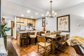 Dining area and kitchen of BlueSky Breckenridge 409.