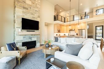 Bright and spacious living room and kitchen area at Mayflower Lakeside 9506.