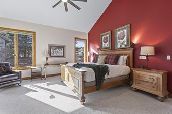 The Cove Retreat bedroom features warm tones and comfortable furnishings for a relaxing stay.