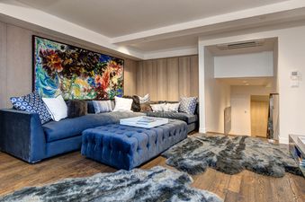 The stylish living area at Abode at the Parkite offers comfortable seating and elegant decor.
