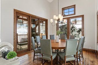 Grand Lodge Five Bedroom 402 features a dining room with a large table and comfortable chairs, perfect for enjoying meals with family and friends.