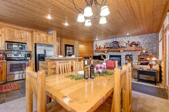 A warm and inviting dining and living space in Black Bear 231.