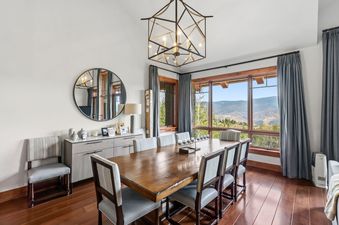Elegant dining area at Hummingbird Overlook at Hummingbird Lodge with mountain views.