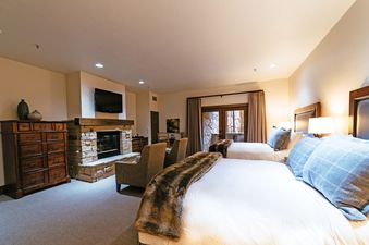 Stein Eriksen Lodge Deluxe Two Queen Room with Fireplace
