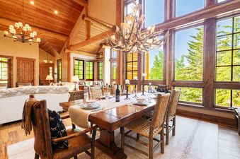 A luxurious dining area and living room in the Deer Valley Oak Lodge.