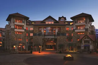 Exterior view of the Franz Klammer Lodge Three Bedroom Residence at dusk.