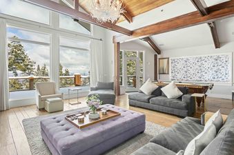 Living room at 6977 Silver Lake Drive with plush seating and expansive windows.