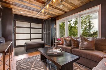 The cozy living area features a plush sofa and stylish decor.