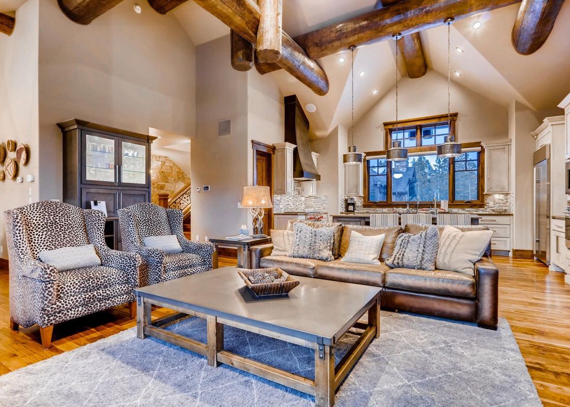 The grand living area of Monarch at Shock Hill features an open-concept design, connecting seamlessly with the kitchen and dining area.