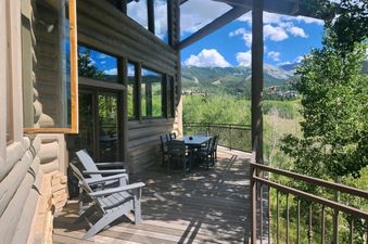 Exterior view of the deck and outdoor seating area at 267 Country Club.